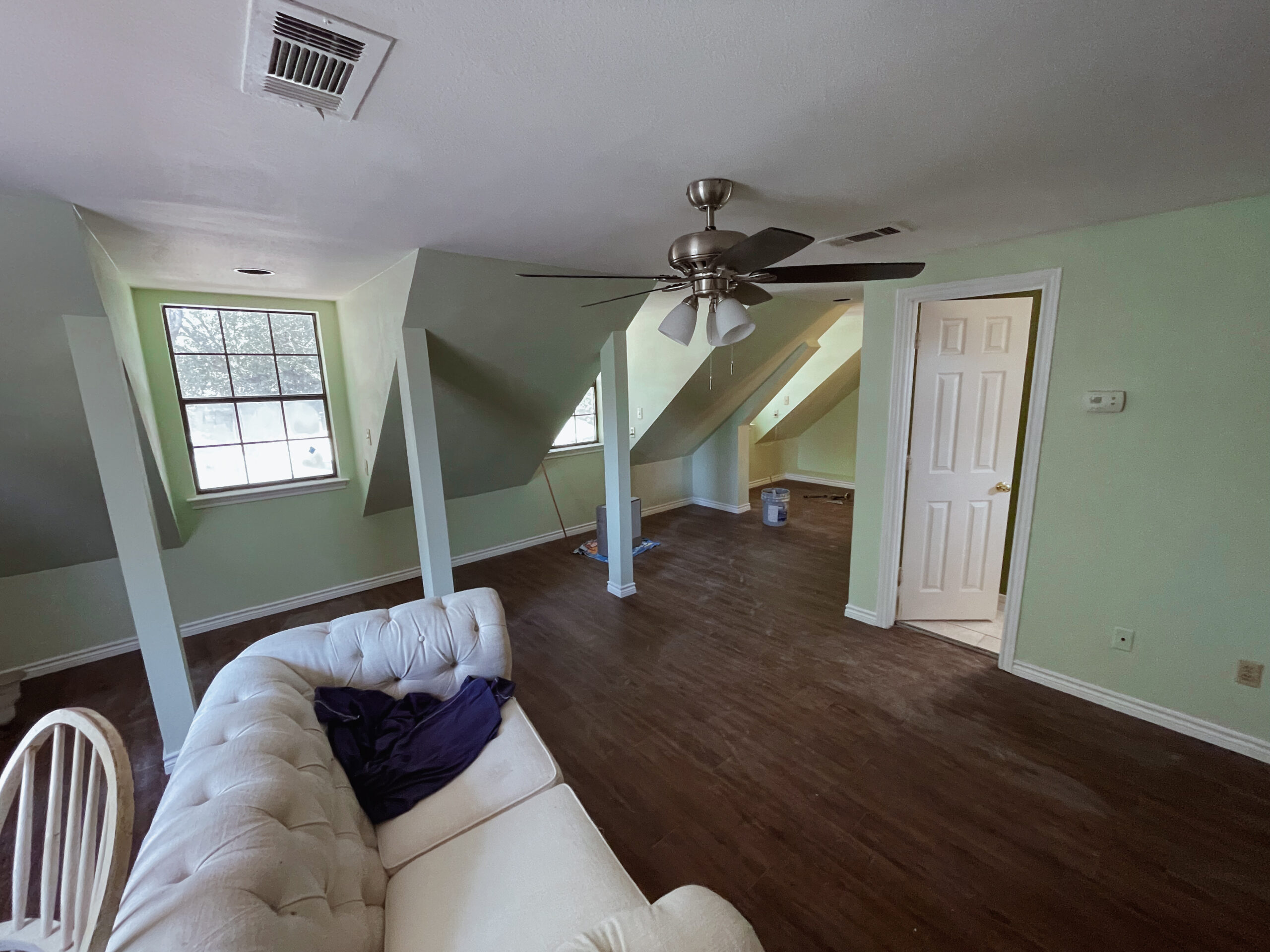 Casabianca Remodeling completed Texas home remodeling services with a fully renovated attic featuring new flooring, paint, and lighting