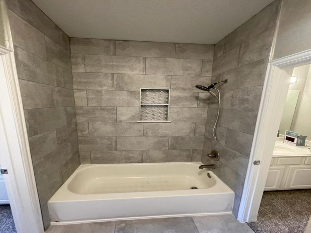 Casabianca Remodeling completed Texas home remodeling services with a fully renovated bathroom featuring new tiles and fixtures