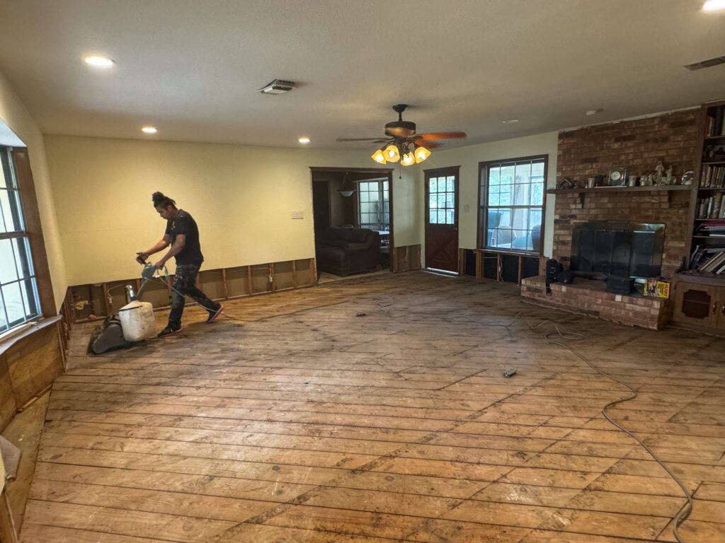 Casabianca Remodeling performing Texas home remodeling services with living room floor sanding and preparation for renovation