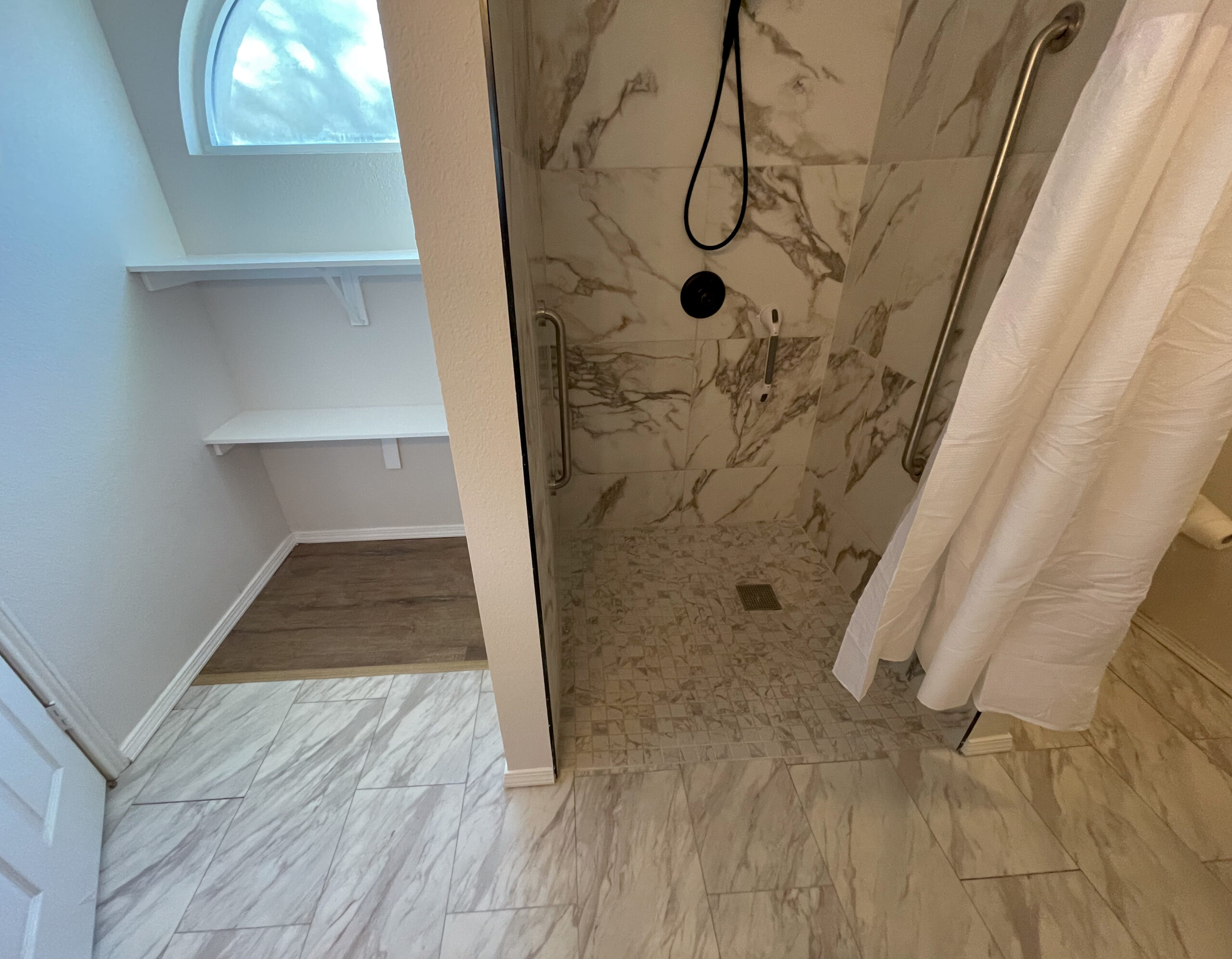 Casabianca Remodeling showcasing Texas home remodeling services with a modernized bathroom, including updated tiles, fixtures, and a glass shower enclosure